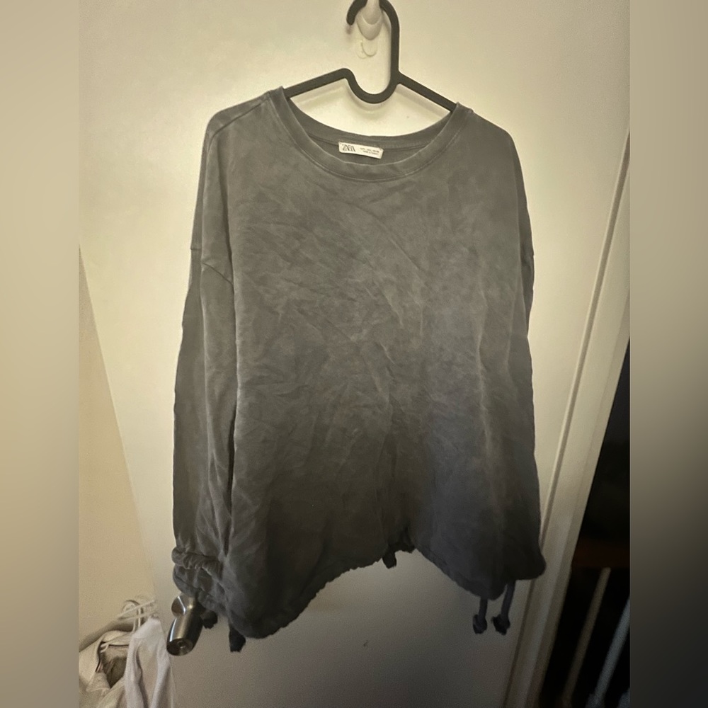 Oversized pull over with rope sleeve